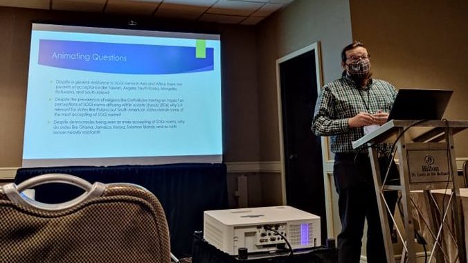 An image showing Robert giving a PowerPoint presentation.